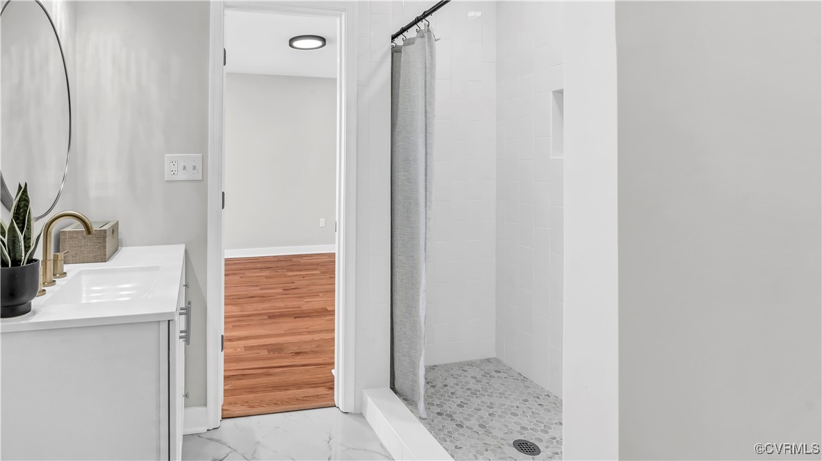 1320 Decatur Street Richmond, VA 23224 - Photo 21 of 36 a bathroom with a sink and a mirror