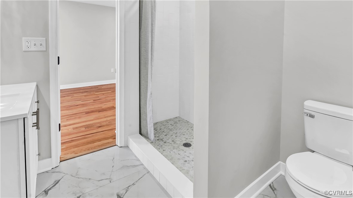 1320 Decatur Street Richmond, VA 23224 - Photo 22 of 36 a bathroom with a toilet and a shower