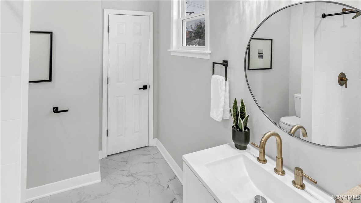 1320 Decatur Street Richmond, VA 23224 - Photo 23 of 36 a bathroom with a sink and mirror