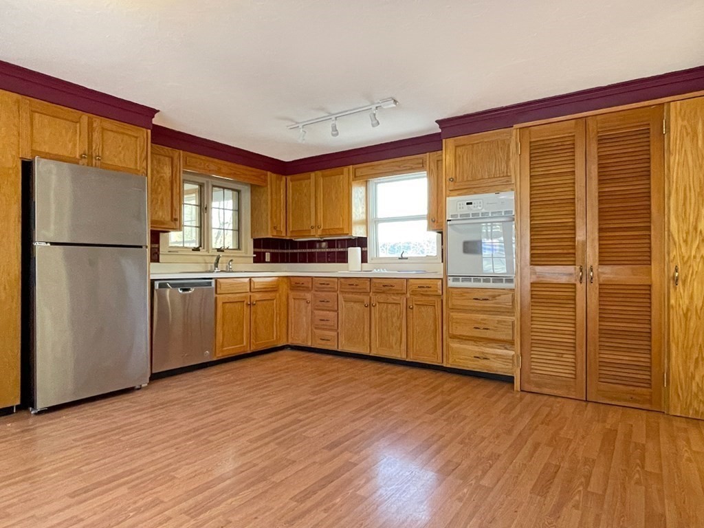 53 Burrows Turnpike Road Bernardston, MA 01337 - Photo 16 of 42 a kitchen with stainless steel appliances a refrigerator sink and cabinets