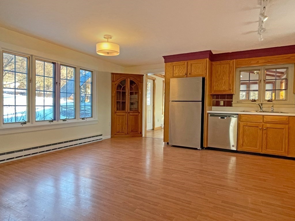 53 Burrows Turnpike Road Bernardston, MA 01337 - Photo 18 of 42 a kitchen with stainless steel appliances granite countertop a refrigerator a sink and a stove