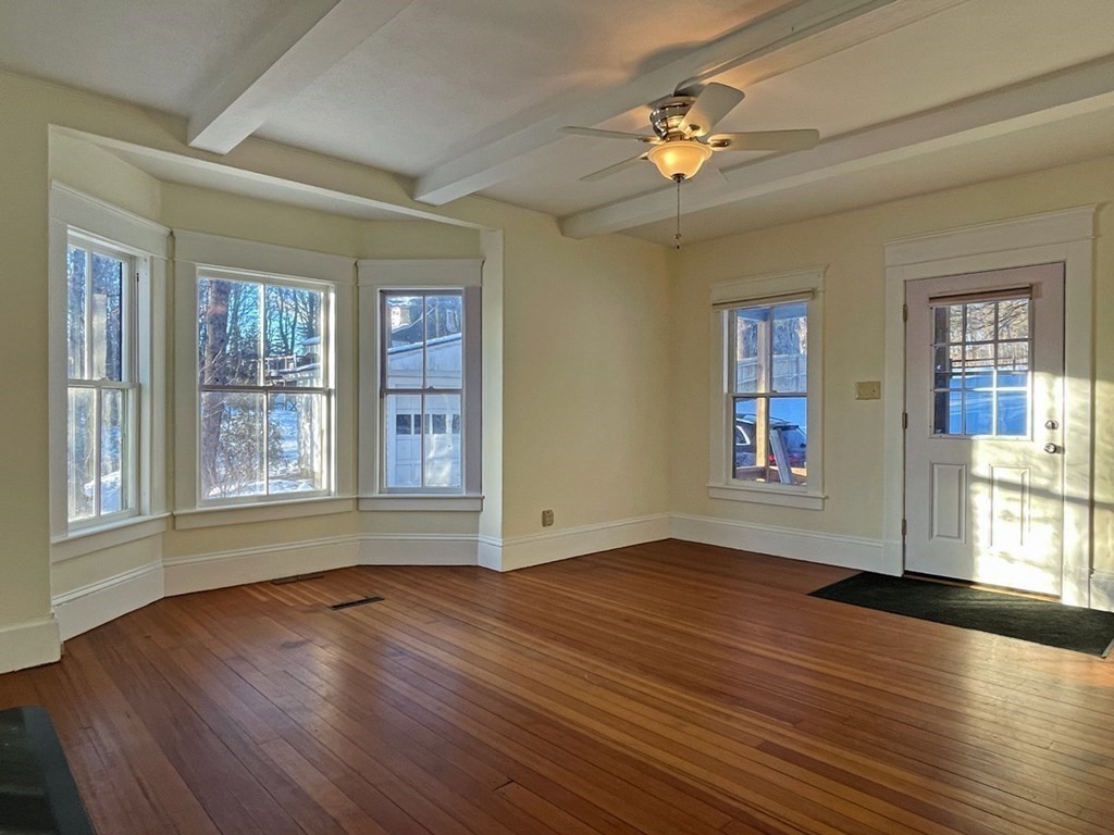 53 Burrows Turnpike Road Bernardston, MA 01337 - Photo 21 of 42 a view of an empty room with wooden floor and a window