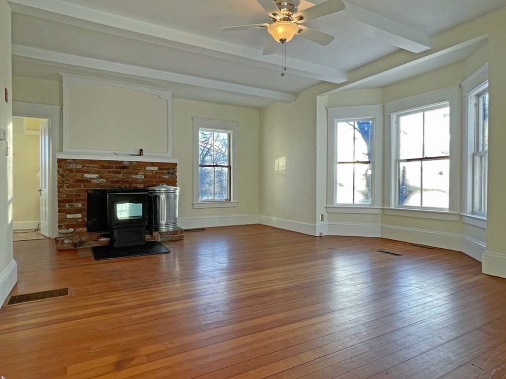 53 Burrows Turnpike Road Bernardston, MA 01337 - Photo 23 of 42 a view of an empty room with wooden floor and a window