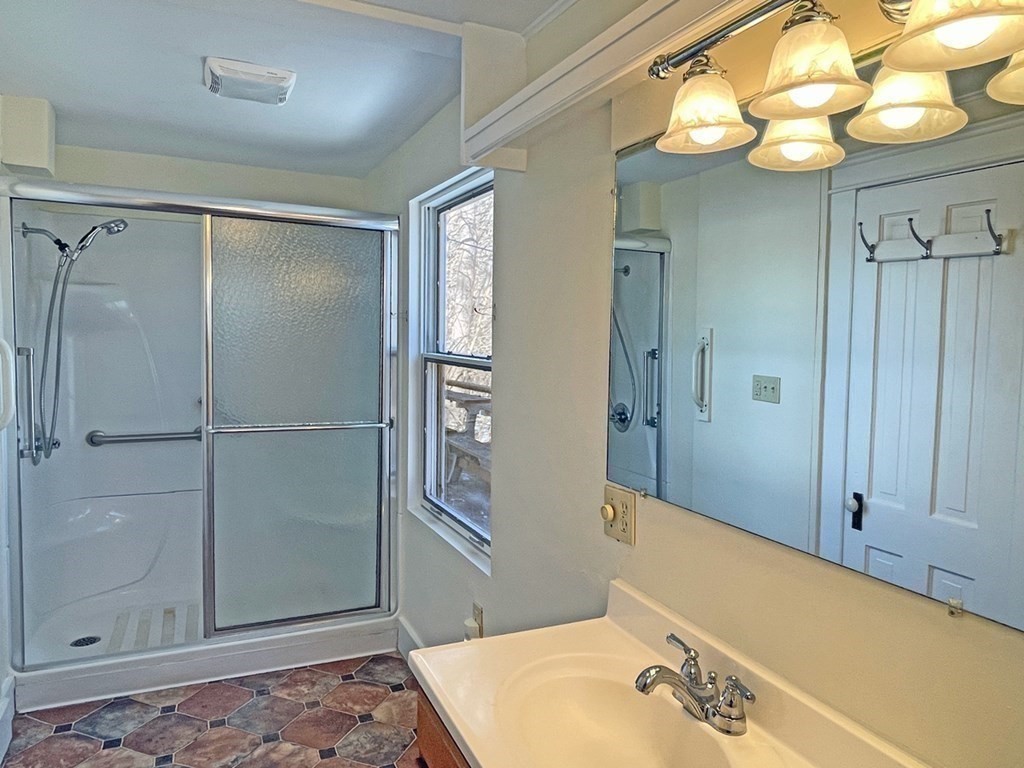 53 Burrows Turnpike Road Bernardston, MA 01337 - Photo 24 of 42 a bathroom with a tub and shower