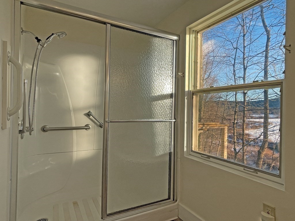 53 Burrows Turnpike Road Bernardston, MA 01337 - Photo 25 of 42 a bathroom with a glass shower door