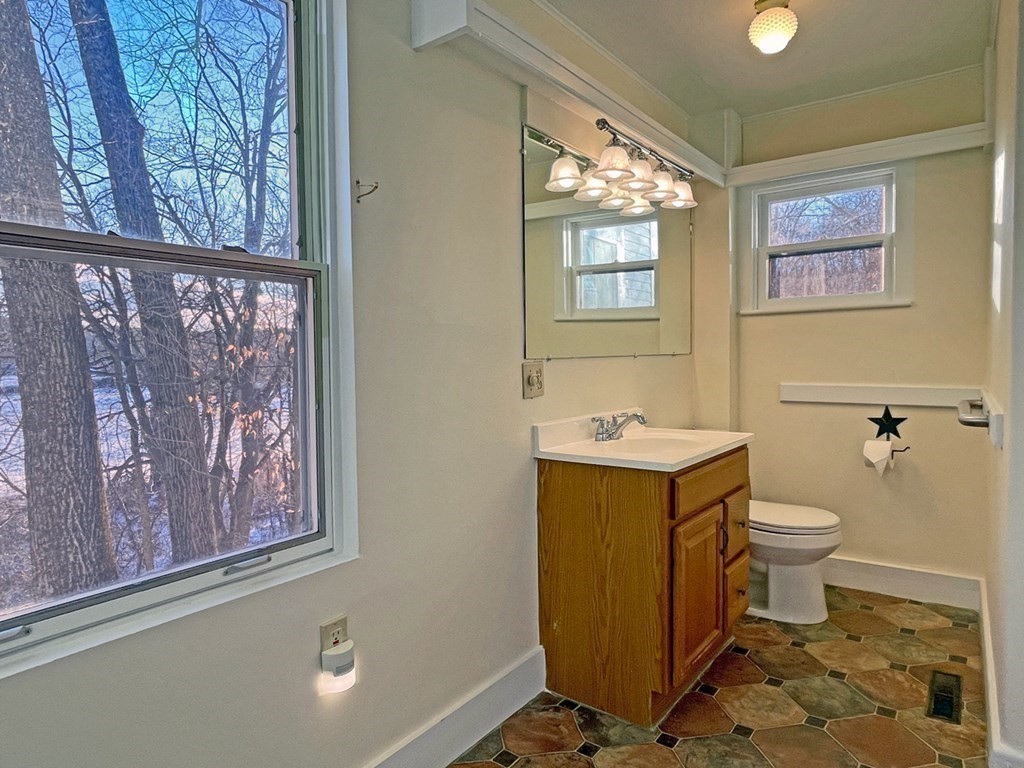 53 Burrows Turnpike Road Bernardston, MA 01337 - Photo 26 of 42 a bathroom with a toilet sink and mirror