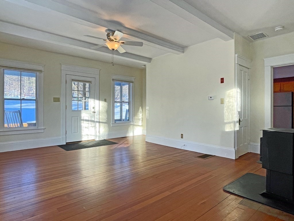 53 Burrows Turnpike Road Bernardston, MA 01337 - Photo 27 of 42 a view of an empty room with wooden floor and a window