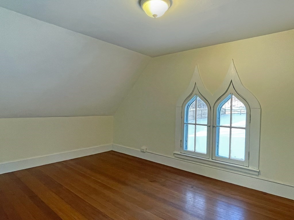 53 Burrows Turnpike Road Bernardston, MA 01337 - Photo 33 of 42 an empty room with wooden floor and windows