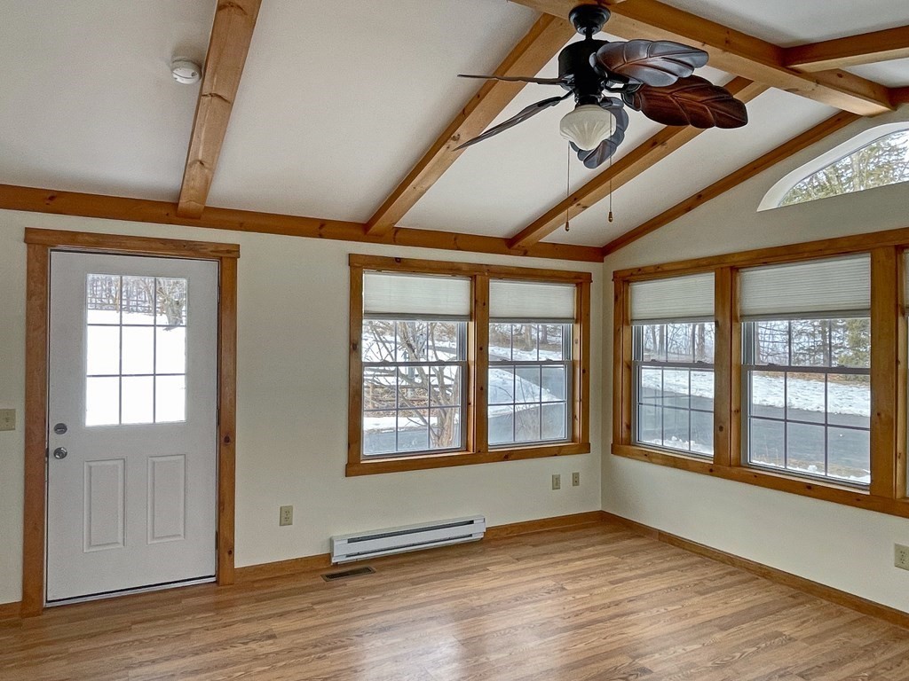 53 Burrows Turnpike Road Bernardston, MA 01337 - Photo 7 of 42 a view of an empty room with wooden floor and a window