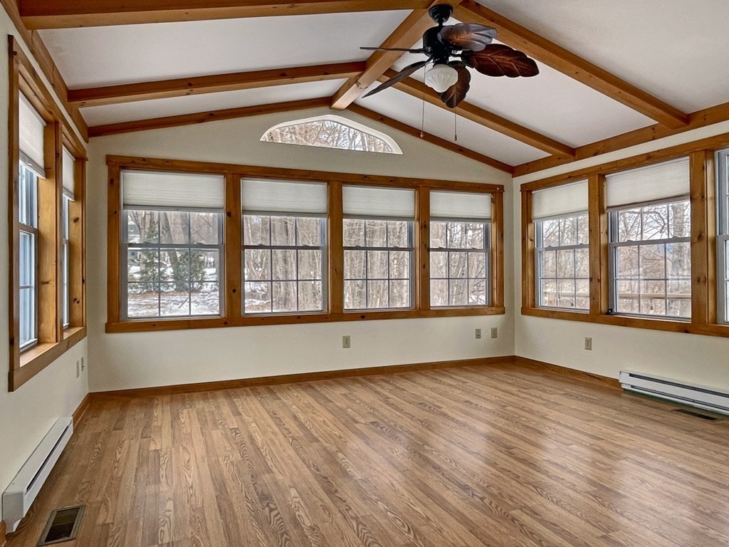 53 Burrows Turnpike Road Bernardston, MA 01337 - Photo 8 of 42 a view of an empty room with wooden floor and a window