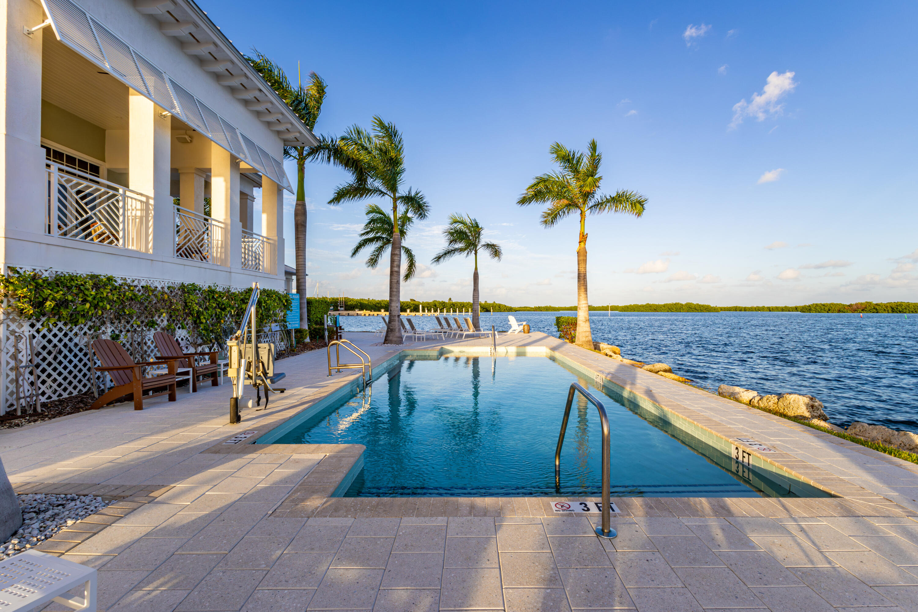 25 East Playa Largo Blvd Key Key Largo, FL 33037 - Photo 15 of 55 a view of swimming pool with a lounge chair