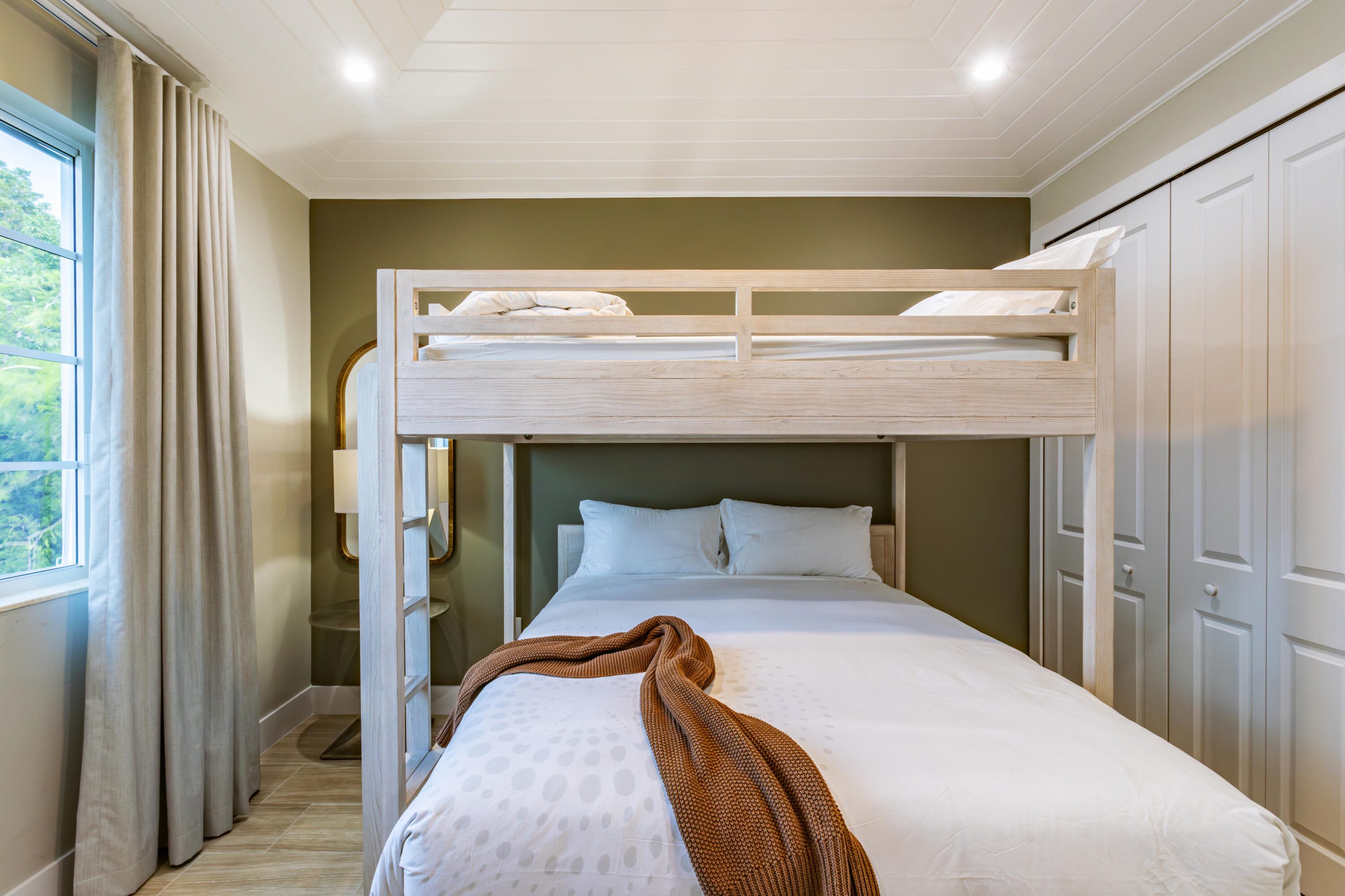 25 East Playa Largo Blvd Key Key Largo, FL 33037 - Photo 36 of 55 a bedroom with a bed and a mirror