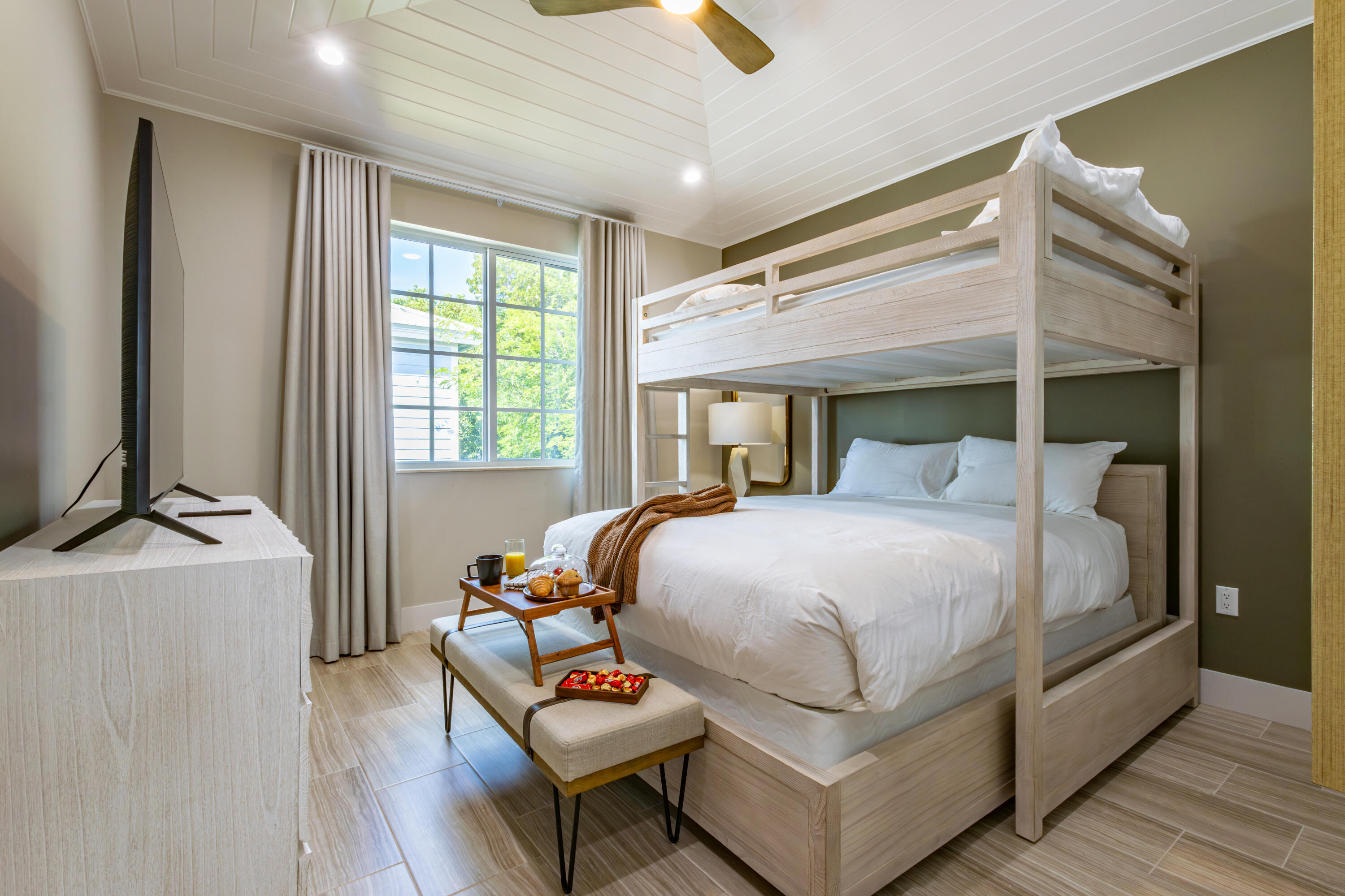 25 East Playa Largo Blvd Key Key Largo, FL 33037 - Photo 37 of 55 a bedroom with a bed a flat screen tv and a couch