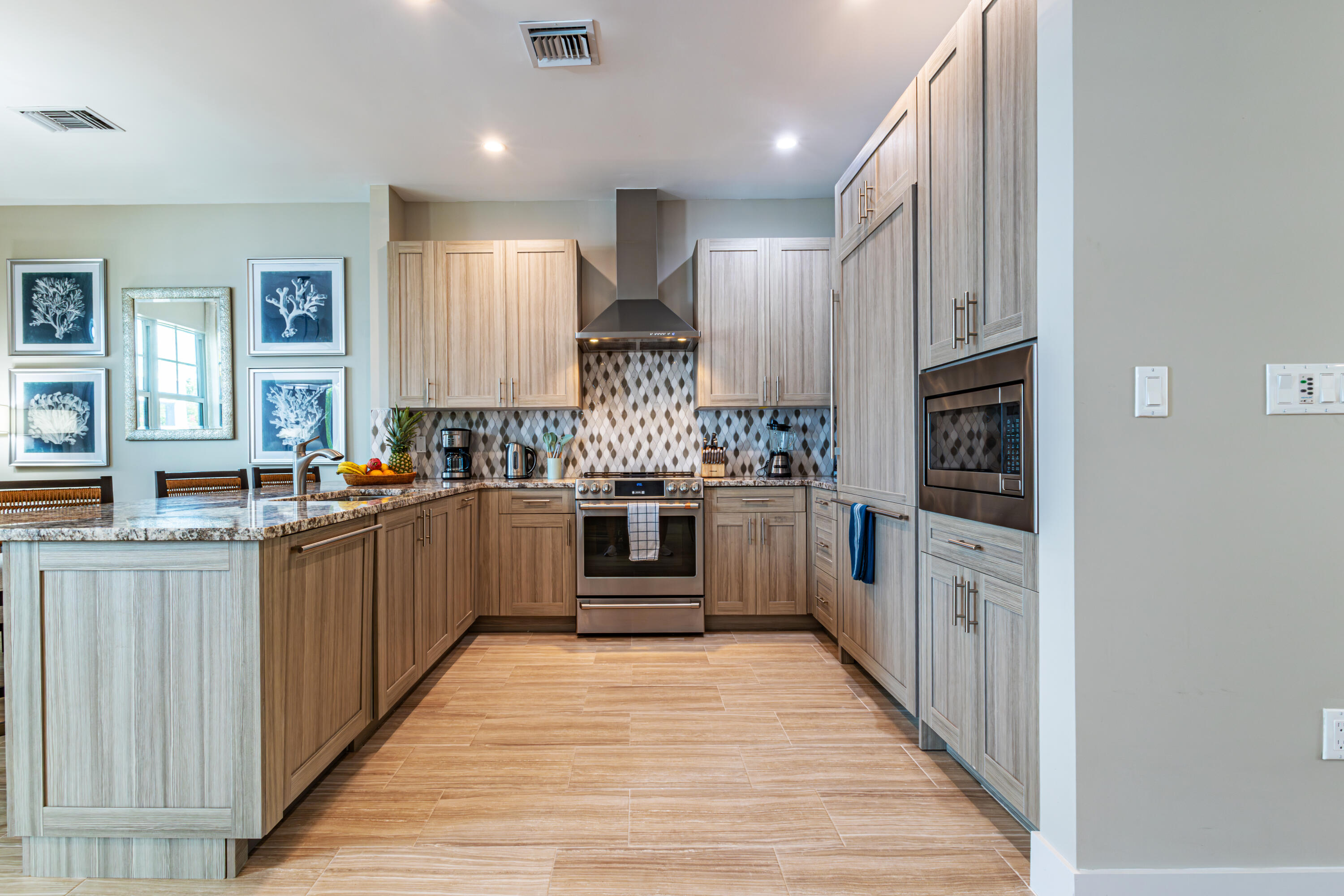 25 East Playa Largo Blvd Key Key Largo, FL 33037 - Photo 6 of 55 a kitchen with stainless steel appliances sink refrigerator and microwave