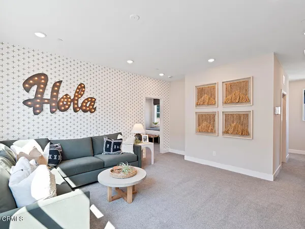 a living room with furniture and a table