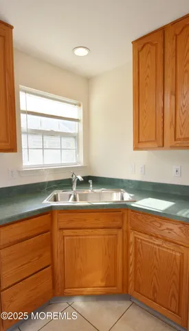 a kitchen with stainless steel appliances granite countertop a stove and a microwave