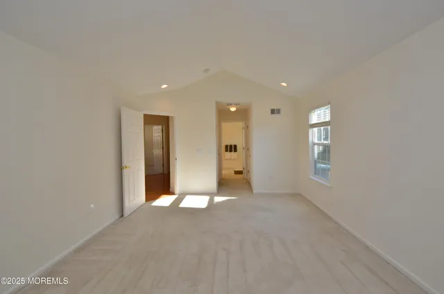 a bathroom with a sink mirror and toilet