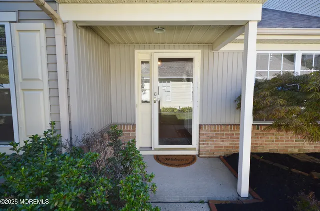a backyard of a house with seating space