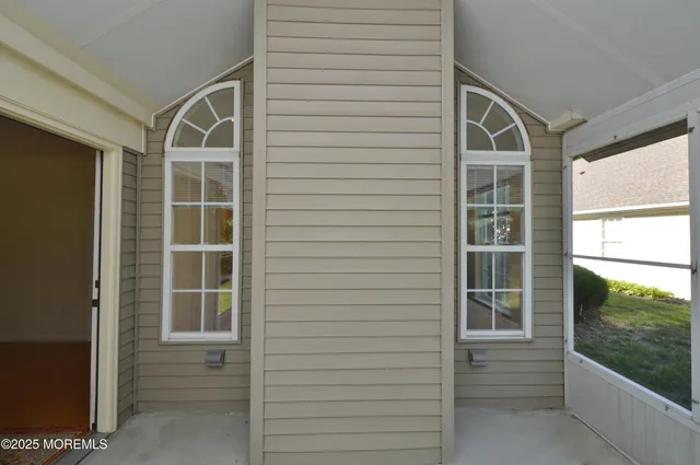 a view of a garden with lawn chairs
