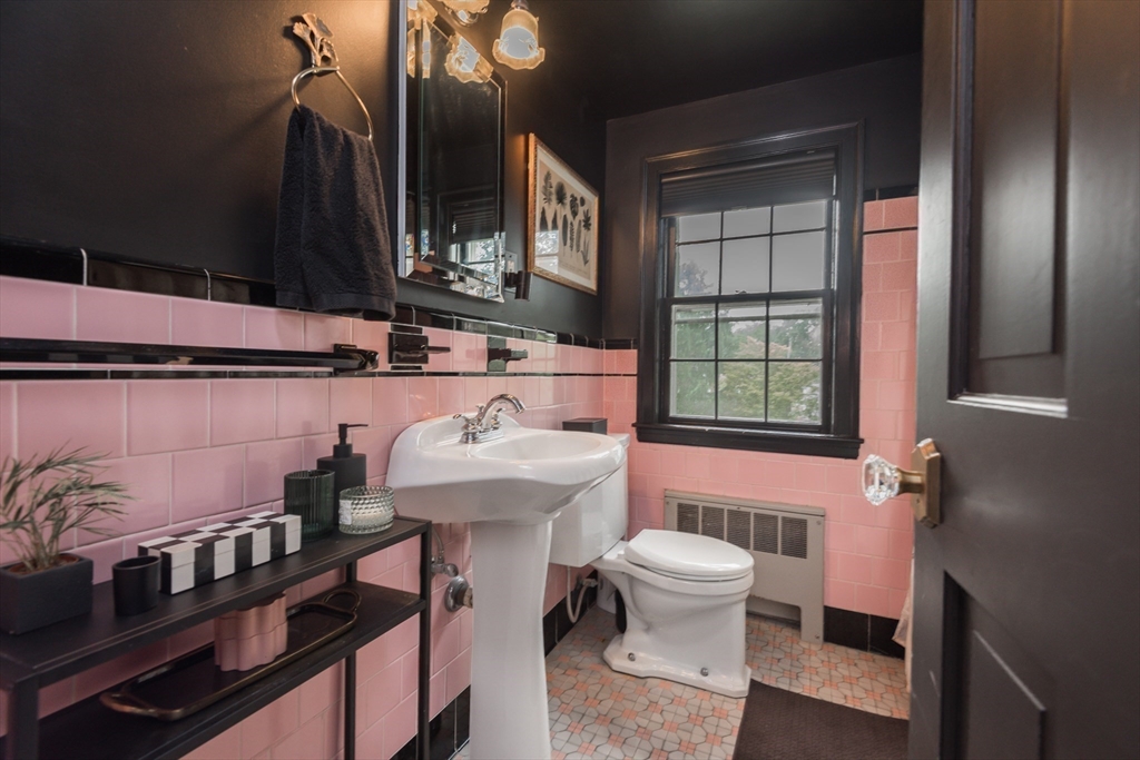 7 Robinson Road Woburn, MA 01801 - Photo 12 of 21 a bathroom with a sink a toilet and tub