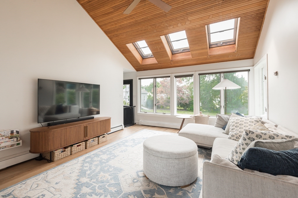 7 Robinson Road Woburn, MA 01801 - Photo 2 of 21 a living room with furniture and a flat screen tv
