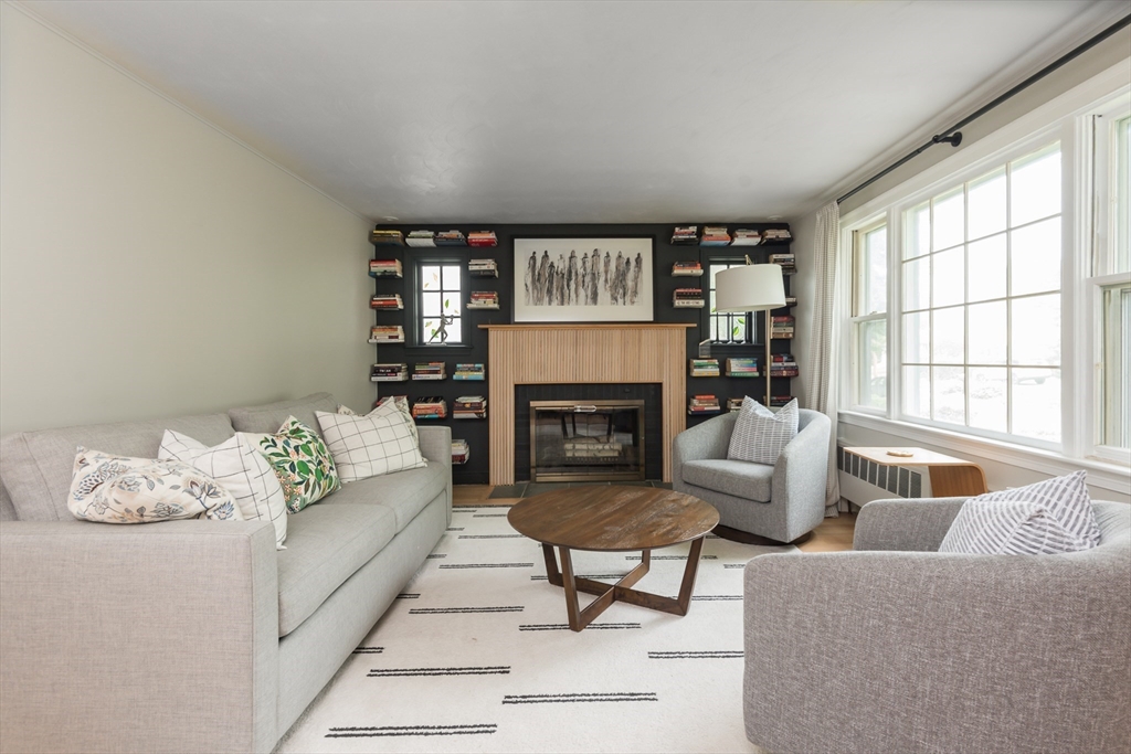 7 Robinson Road Woburn, MA 01801 - Photo 8 of 21 a living room with furniture and a fireplace