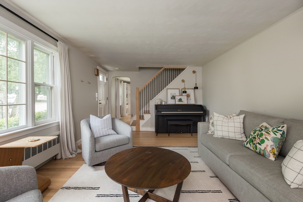 7 Robinson Road Woburn, MA 01801 - Photo 9 of 21 a living room with furniture and a fireplace