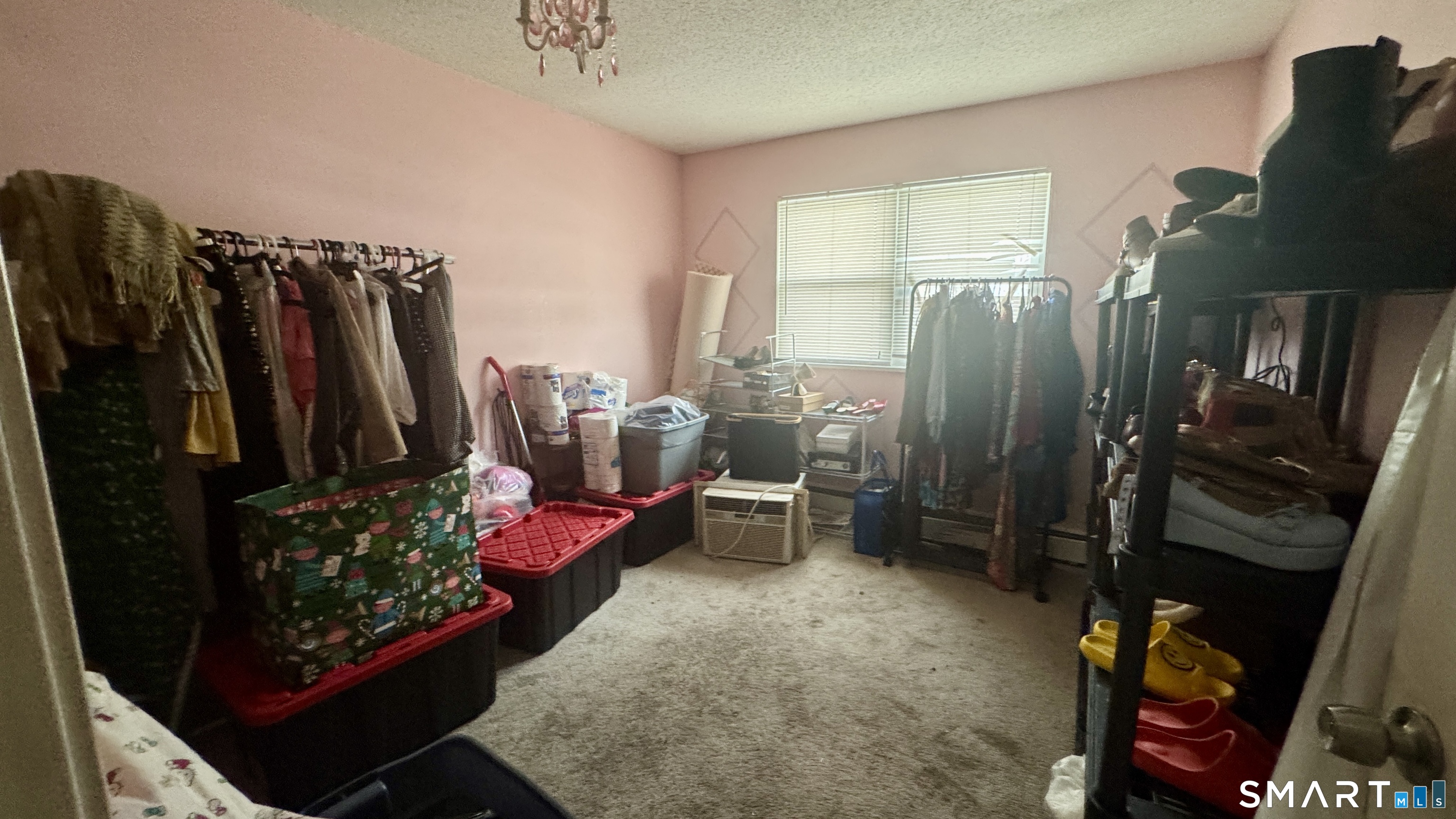 49 Ridge Road, Unit 2 Naugatuck, CT 06770 - Photo 9 of 18 a view of walk in closet with clothes and shoes