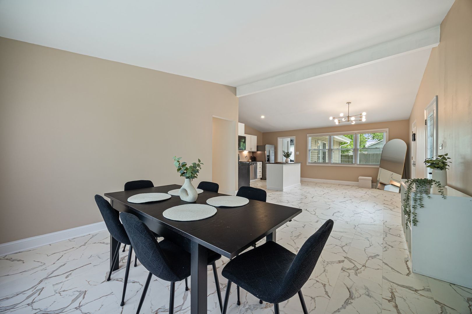 2117 Grouse Lane Rolling Meadows, IL 60008 - Photo 10 of 25 a view of a dining room and livingroom with furniture wooden floor and a rug