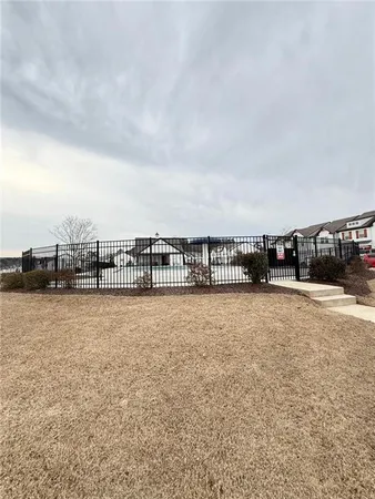 a view of a swimming pool and an outdoor seating