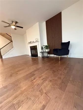 a view of a livingroom with furniture and a rug