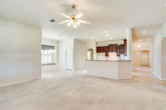 a view of a kitchen with furniture and a fireplace
