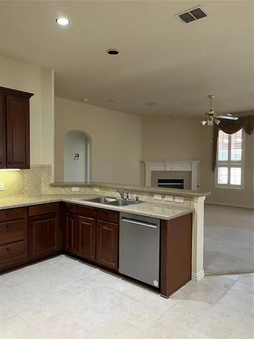 a kitchen with a stove and a sink