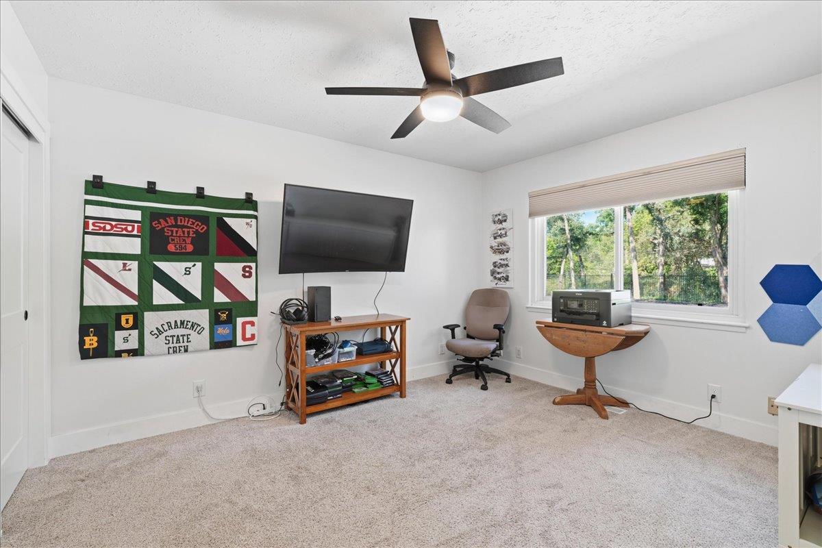4849 Alexon Way Carmichael, CA 95608 - Photo 28 of 50 a living room with furniture and a flat screen tv