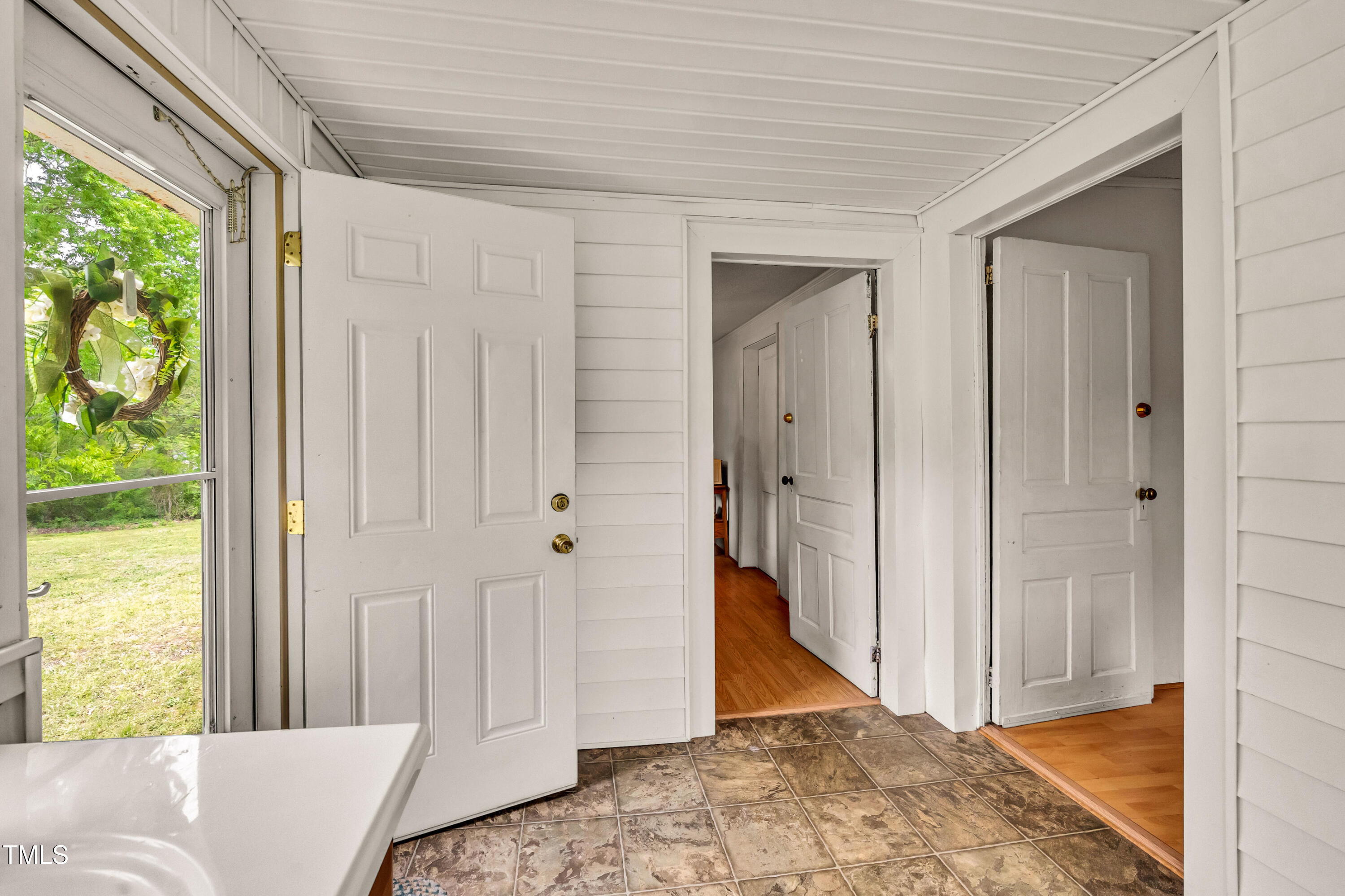 489 Purvis Farm Road Robbins, NC 27325 - Photo 16 of 32 a view of a bedroom with wooden floor and windows