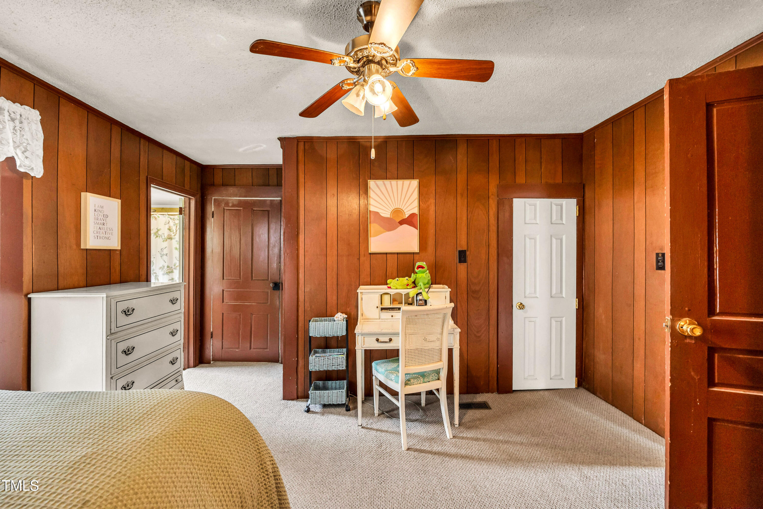 489 Purvis Farm Road Robbins, NC 27325 - Photo 18 of 32 a bedroom with a bed and a chandelier