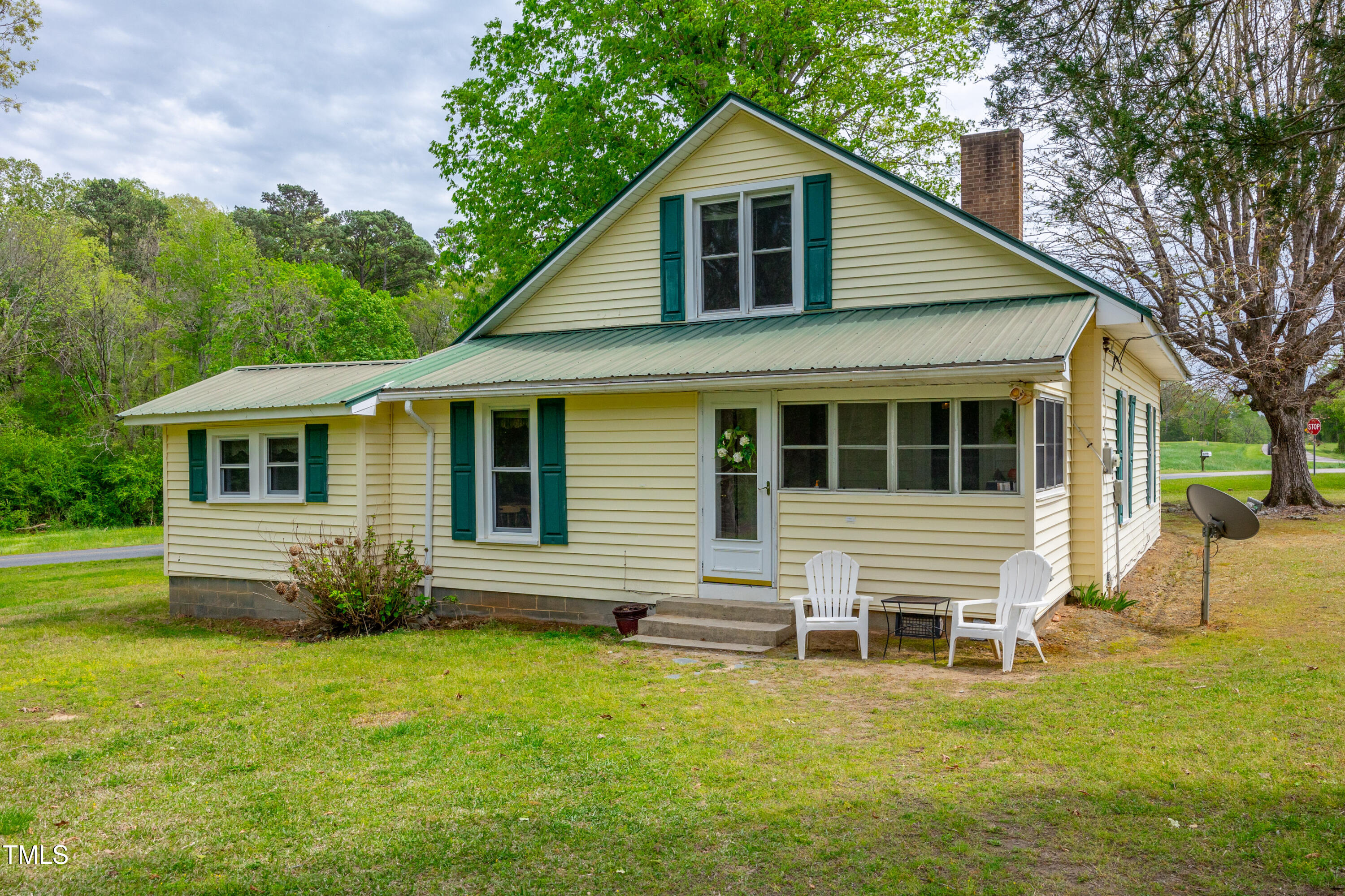 489 Purvis Farm Road Robbins, NC 27325 - Photo 30 of 32 a front view of a house with a garden