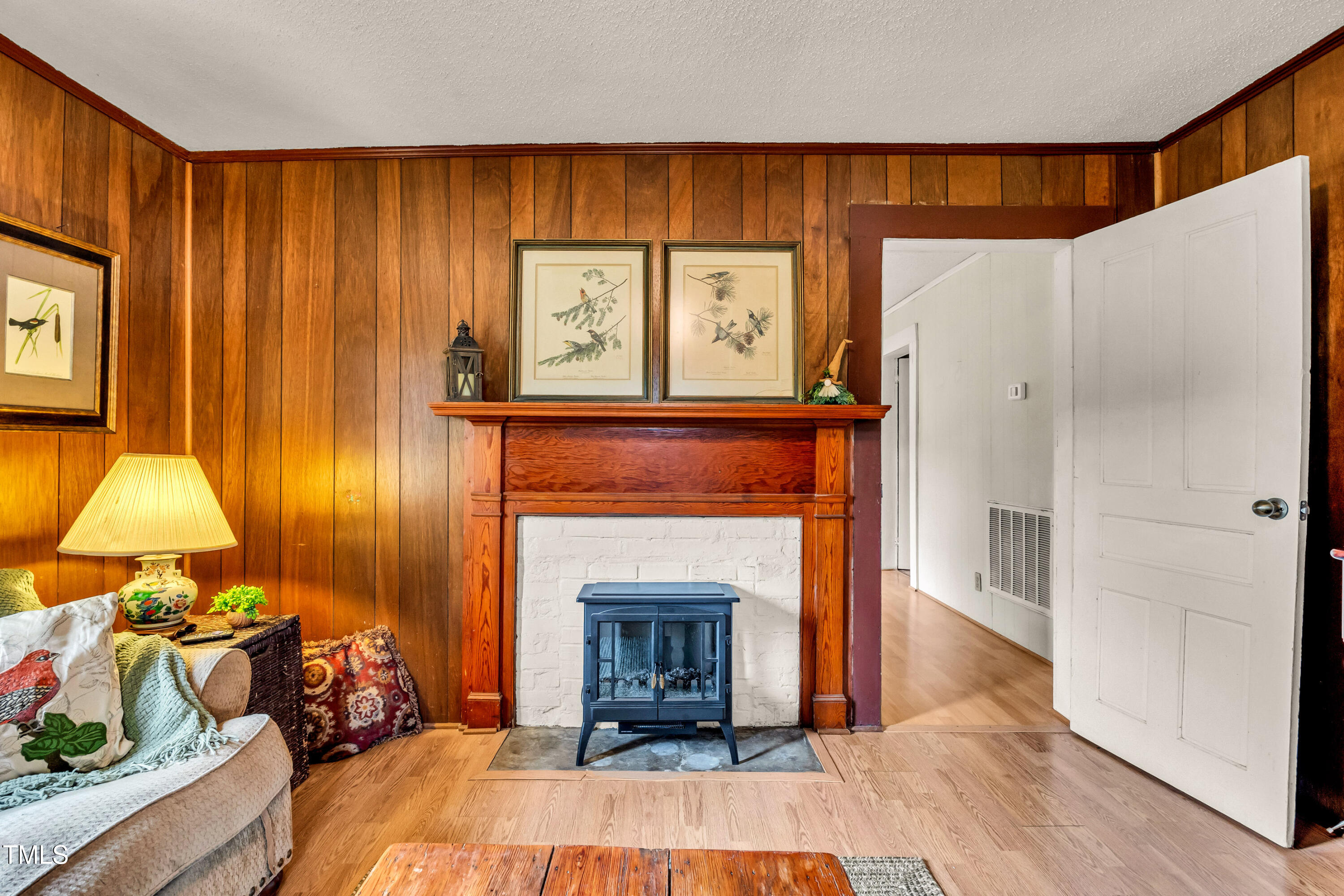 489 Purvis Farm Road Robbins, NC 27325 - Photo 6 of 32 a living room with furniture and a fireplace