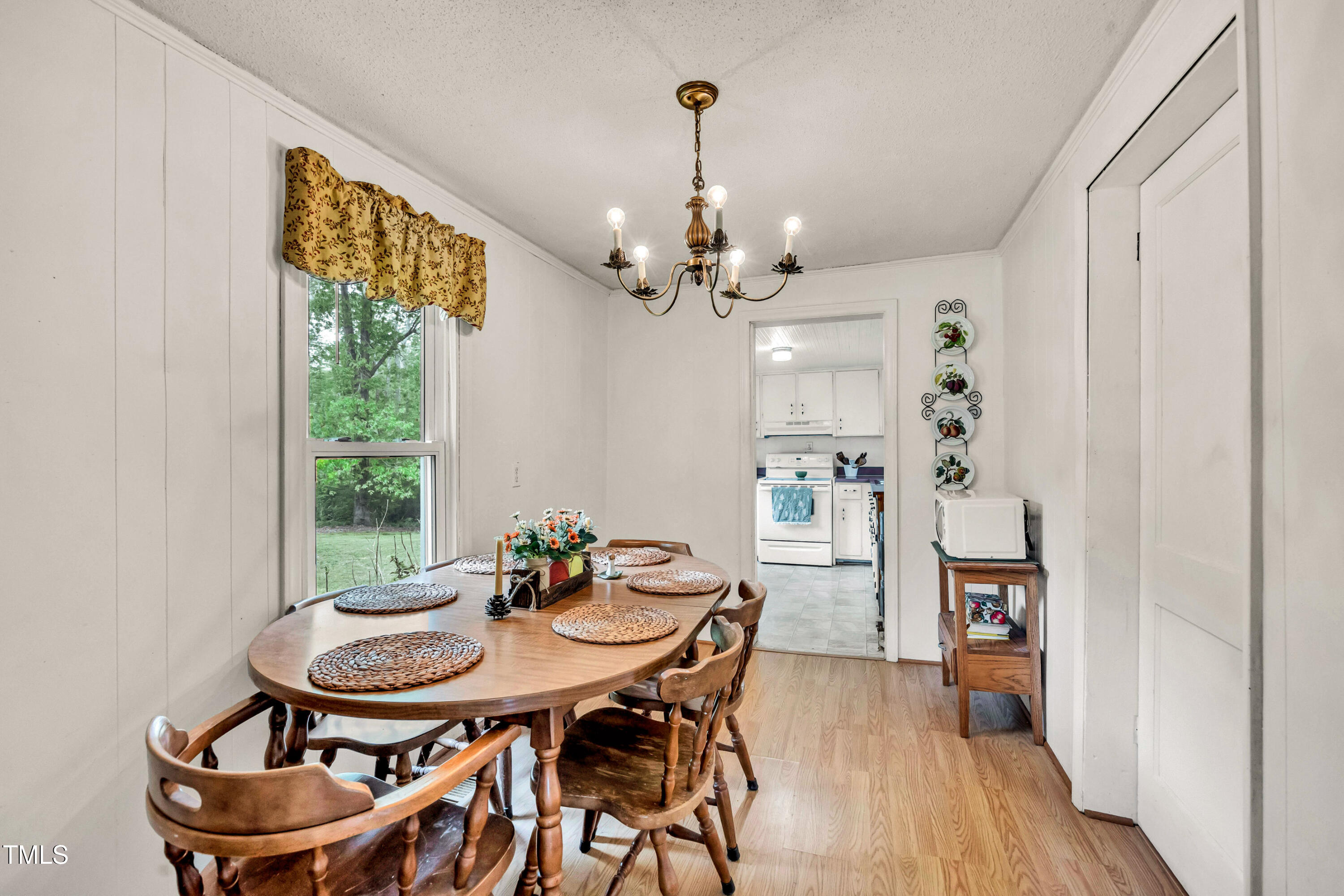 489 Purvis Farm Road Robbins, NC 27325 - Photo 10 of 32 a view of a dining room with furniture window and wooden floor