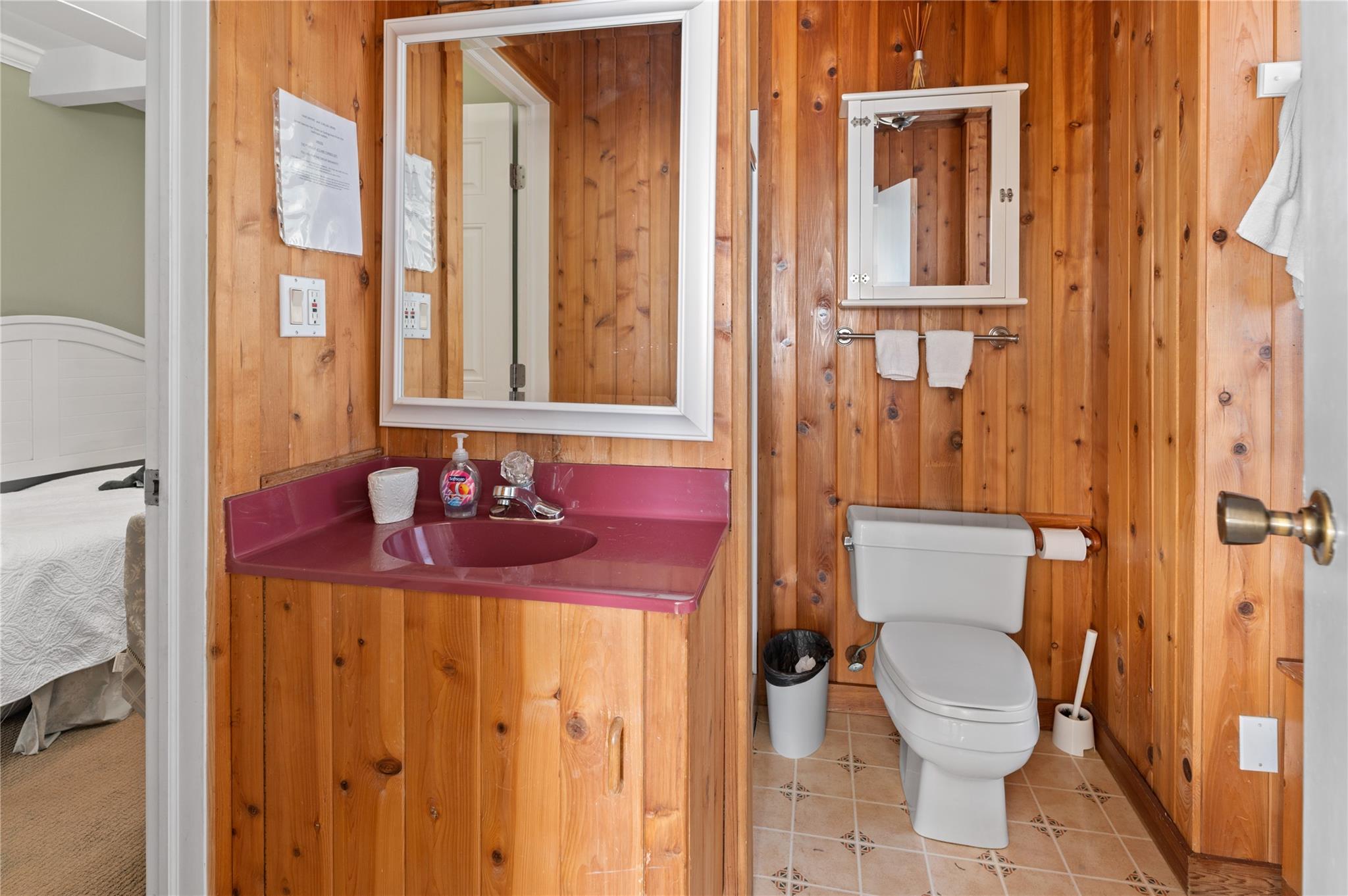 400 Ocean View Walk Ocean Beach, NY 11770 - Photo 19 of 21 a bathroom with a granite countertop sink mirror vanity and toilet
