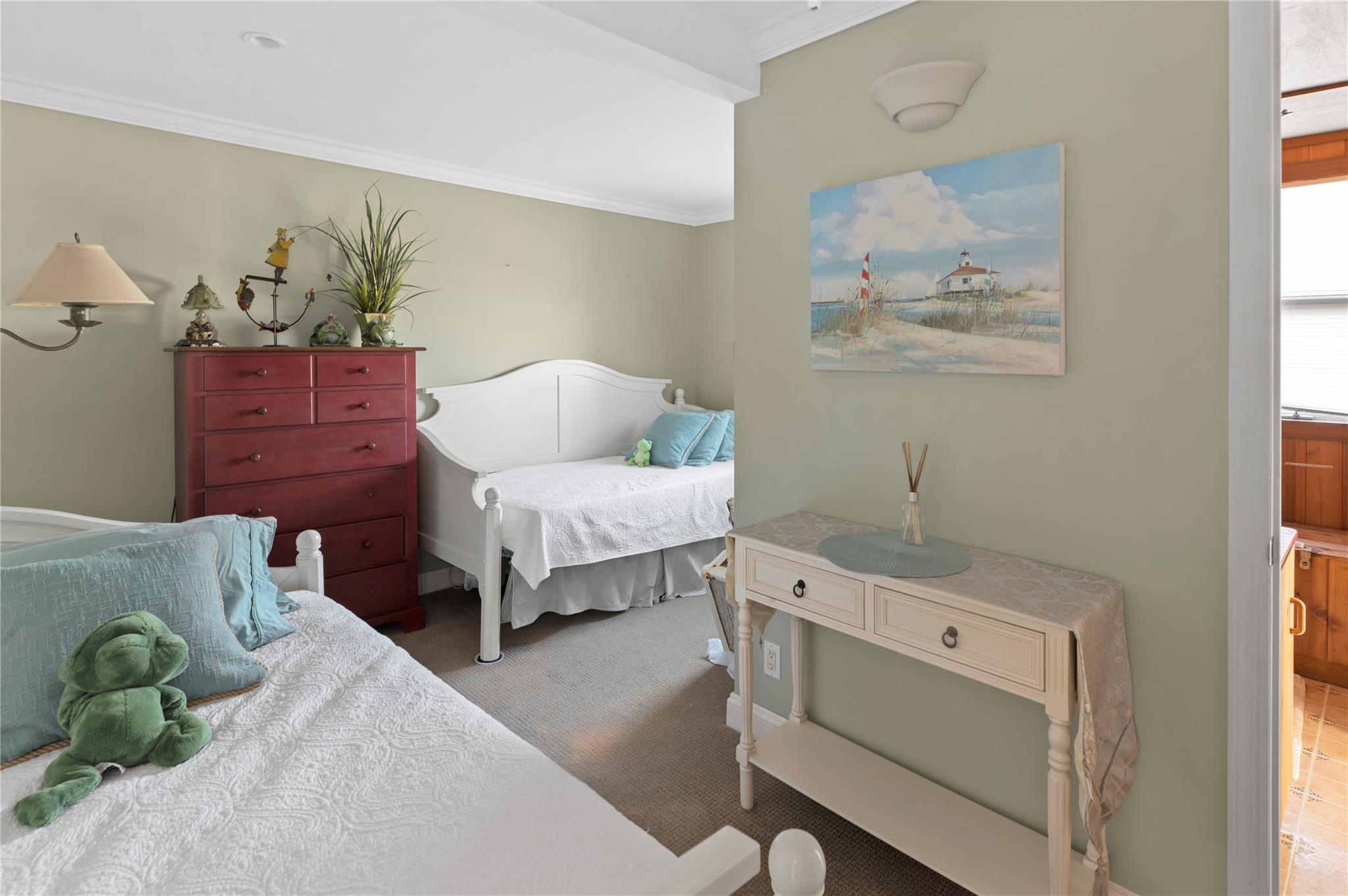 400 Ocean View Walk Ocean Beach, NY 11770 - Photo 20 of 21 a bedroom with a bed and ceiling fan