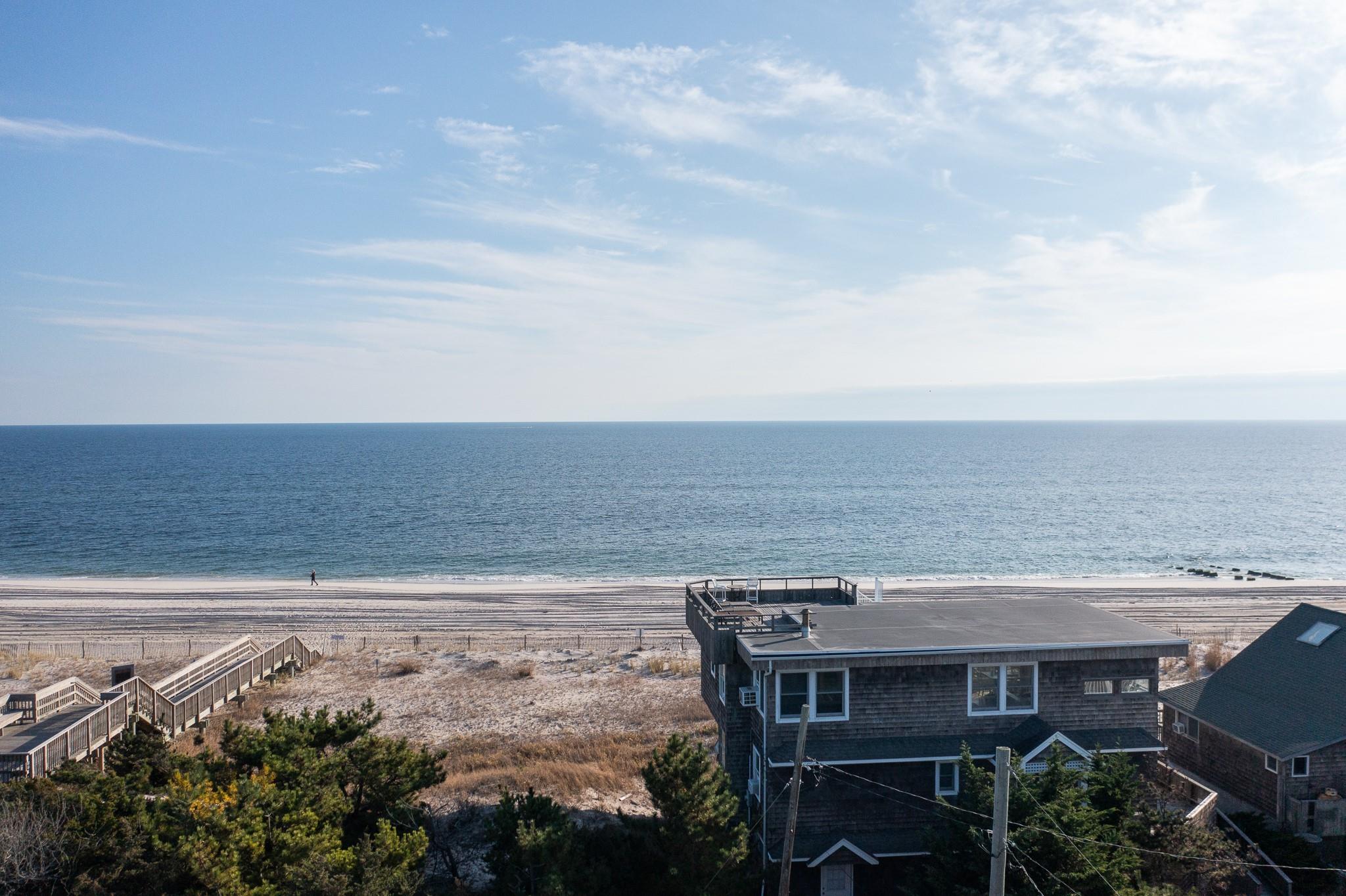 400 Ocean View Walk Ocean Beach, NY 11770 - Photo 6 of 21 a view of a terrace with a table and chairs