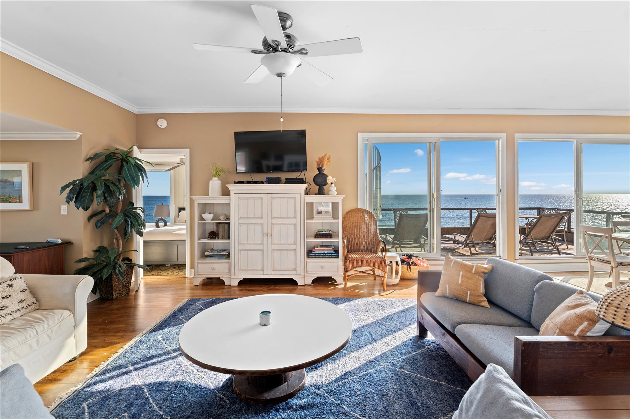 400 Ocean View Walk Ocean Beach, NY 11770 - Photo 7 of 21 a living room with furniture a fireplace and a flat screen tv