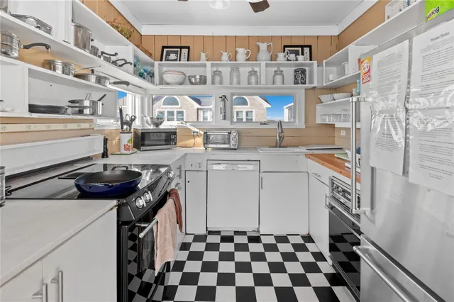 a kitchen with stainless steel appliances granite countertop a stove and a sink