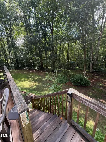 a view of a chairs and tables in the balcony