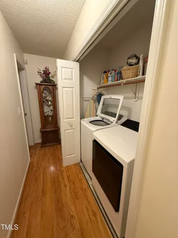 a kitchen with stainless steel appliances kitchen island granite countertop a stove a sink and a microwave