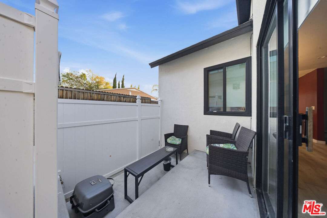 20237 Hartland Street Winnetka, CA 91306 - Photo 10 of 13 a view of balcony with furniture