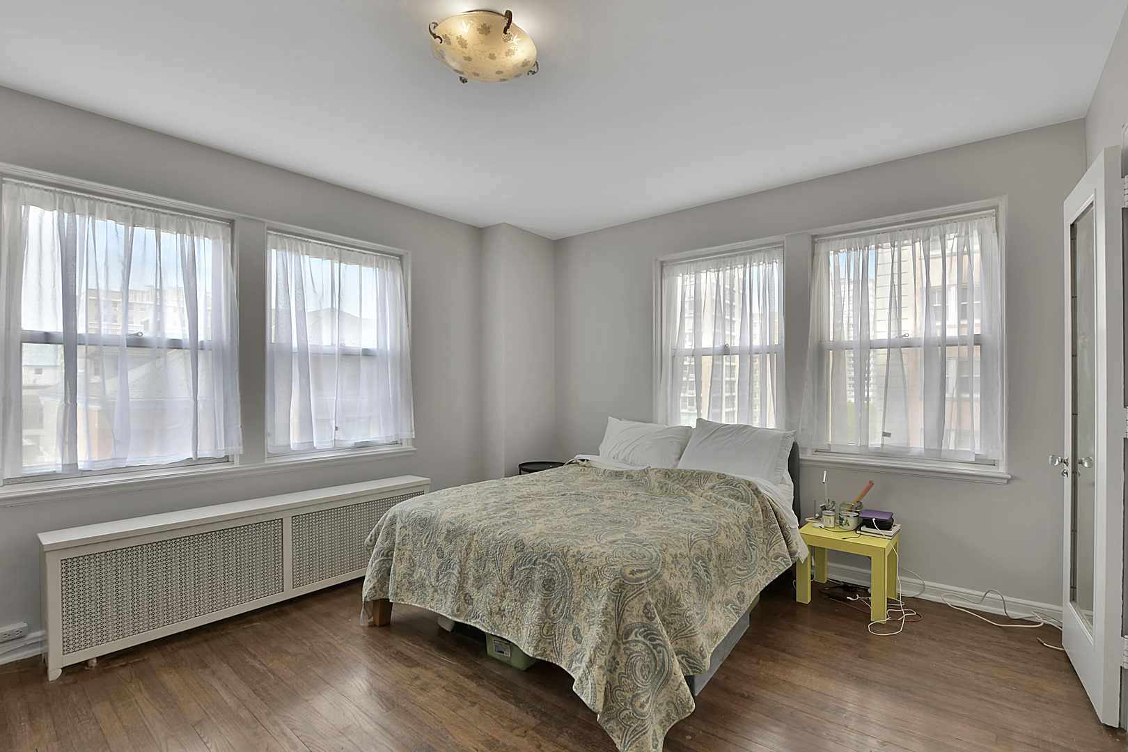 5555 North Sheridan Road, Unit 507 Chicago, IL 60640 - Photo 11 of 15 a bedroom with a bed and window