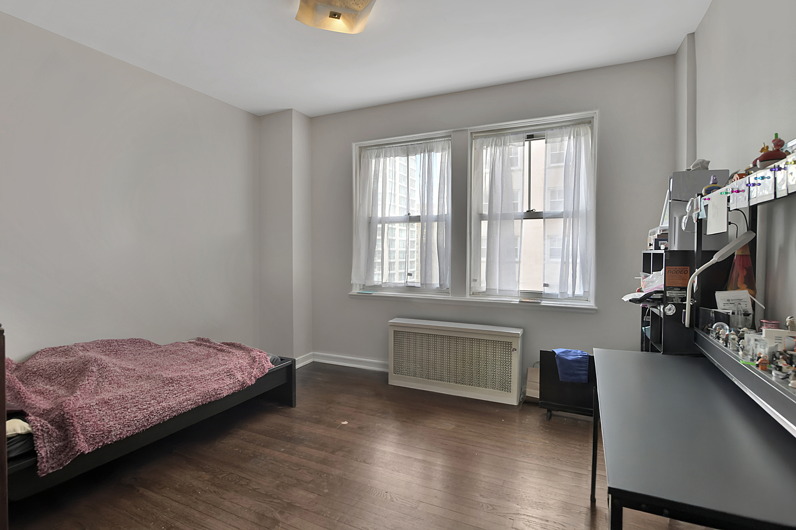 5555 North Sheridan Road, Unit 507 Chicago, IL 60640 - Photo 13 of 15 a bedroom with a bed and a large window