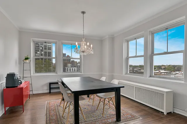 a workspace with furniture window and wooden floor